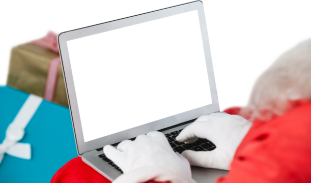 Close-up of Santa Claus using laptop against white background