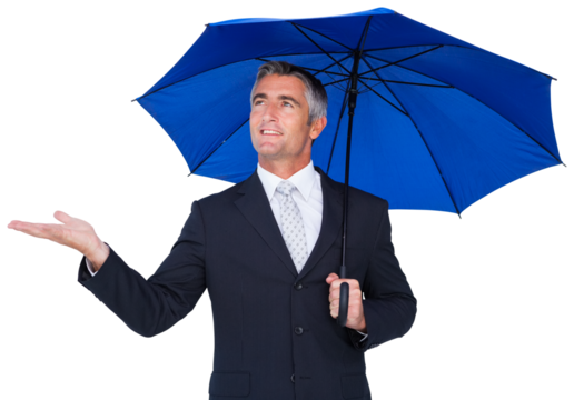 Businessman holding blue umbrella with hand out