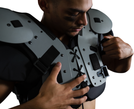 American football player adjusting shoulder pad - Powered by Adobe