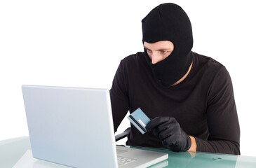 Burglar shopping online with laptop