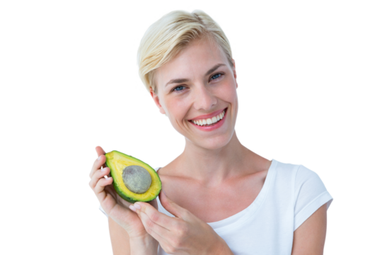 Attractive woman holding fresh avocado