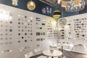 Exhibition stand with stylish lamps and chandeliers. Modern trends in decor and interior design.