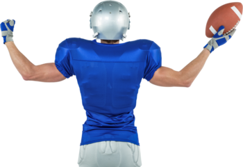 Rear view of American football player holding ball