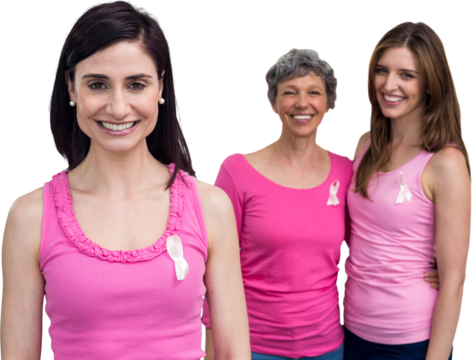 Portrait of smiling women in pink outfits posing for breast cancer awareness