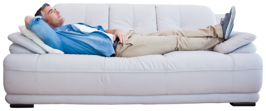 Side view of man resting on sofa