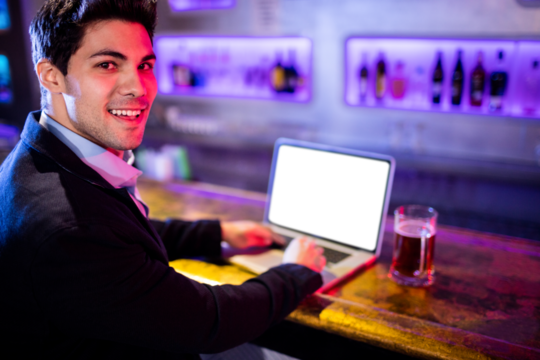 Portarit of businessman using laptop - Powered by Adobe