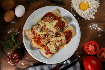 pancake with tomato sauce topped with chicken and cottage cheese with a pile of wheat farinah topped with an egg, tomatoes, herbs and garlic on the side