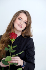 Studio portrait of sensual beautiful woman with rose. High quality photo