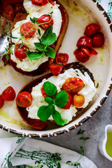 Bruschetta with buratta and baked cherry tomatoes.selective focus