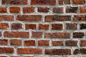 Background of red bricks in a wall