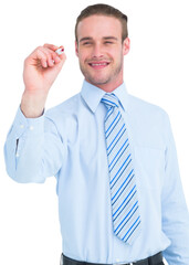 Smiling businessman in shirt writing with marker