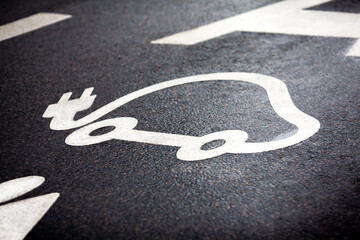 Electric cars: lane for electric cars on the road, electric car icon markings on the pavement