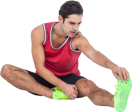 Sportsman doing exercise while touching toes 