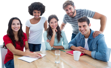 Smiling creative business team looking at the camera