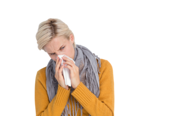 Close up of woman blowing her nose