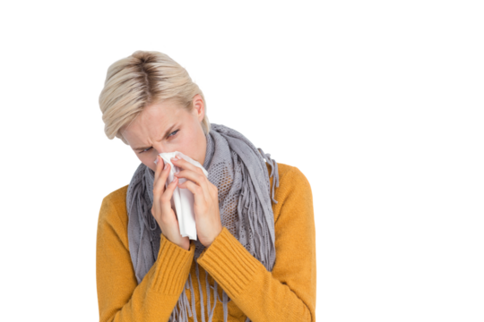 Close up of woman blowing her nose