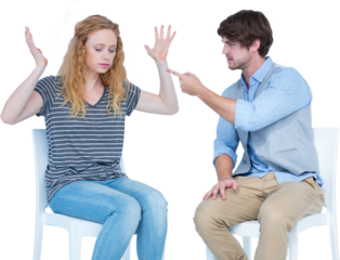 Angry couple quarreling while sitting on chairs