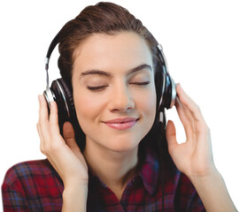 Close-up of beautiful young woman listening music from headphones