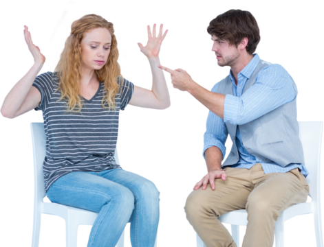 Angry couple quarreling while sitting on chairs