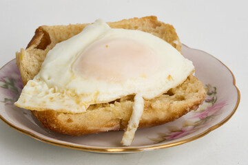 egg over toast isolated on white
