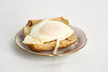 egg over toast isolated on white