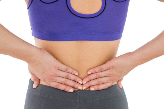 Fit woman suffering from back pain - Powered by Adobe