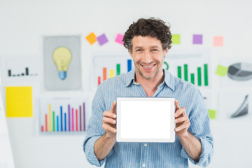 Businessman showing digital tablet with blank screen in creative office
