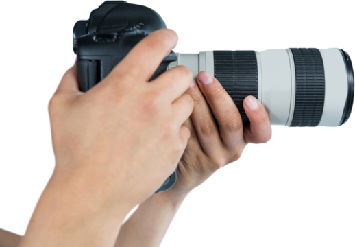 Cropped hands of photographer holding digital camera