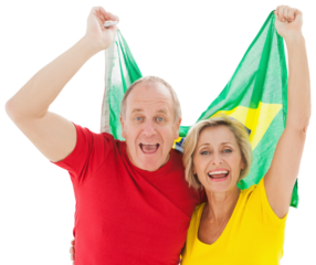Happy older couple cheering at camera holding brazil flag
