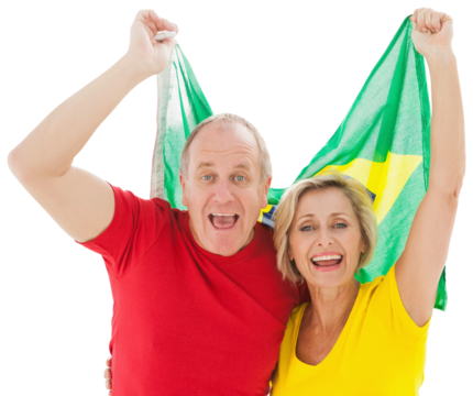 Happy older couple cheering at camera holding brazil flag - Powered by Adobe