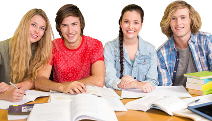 College students doing homework in library