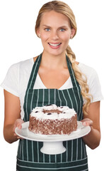 Portrait of young woman holding cake