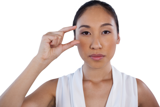 Portrait of serious businesswoman adjusting invisible eyeglasses