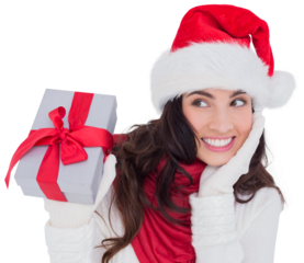 Surprised brunette in santa hat holding gift