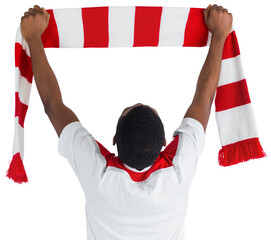 Happy football fan waving scarf