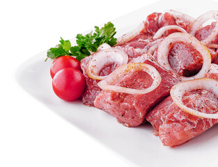 Raw pork meat with onions and spices for cooking kebabs