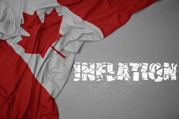 waving colorful national flag of canada on a gray background with broken text inflation. 3d illustration