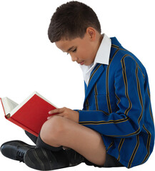 Side view of schoolboy reading book