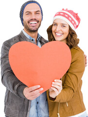 Happy young couple holding heart shape paper