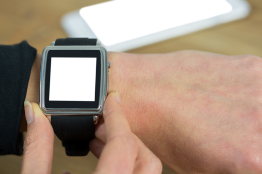 Businesswoman with smart watch on wrist - Powered by Adobe