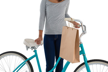 Mid section of woman with paper bag and bicycle - Powered by Adobe