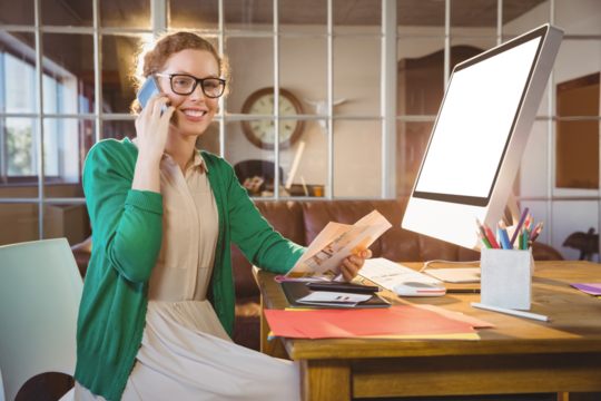 Business woman calling on phone