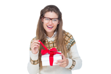 Happy geeky hipster smiling at camera and holding present