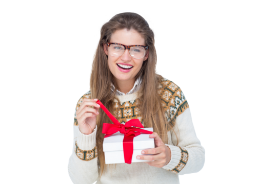 Happy geeky hipster smiling at camera and holding present
