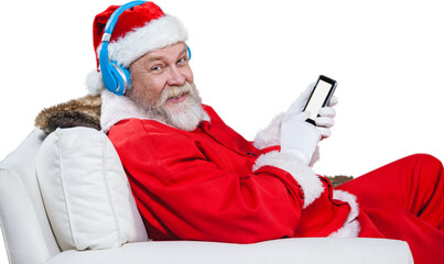 Santa Claus with headphones using mobile phone