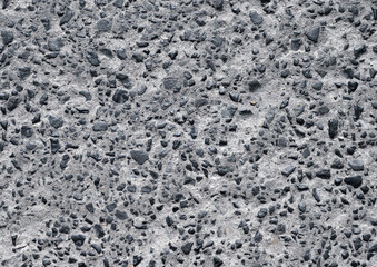 Asphalt texture with melted small stones.