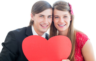 Cute geeky couple smiling and holding heart 