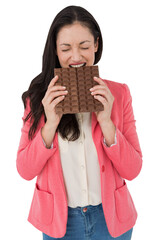 Brunette biting bar of chocolate