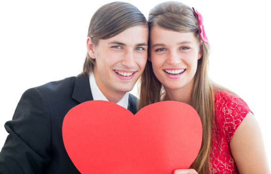 Cute geeky couple smiling and holding heart 