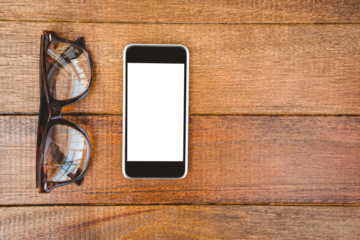 View of glasses and a smartphone